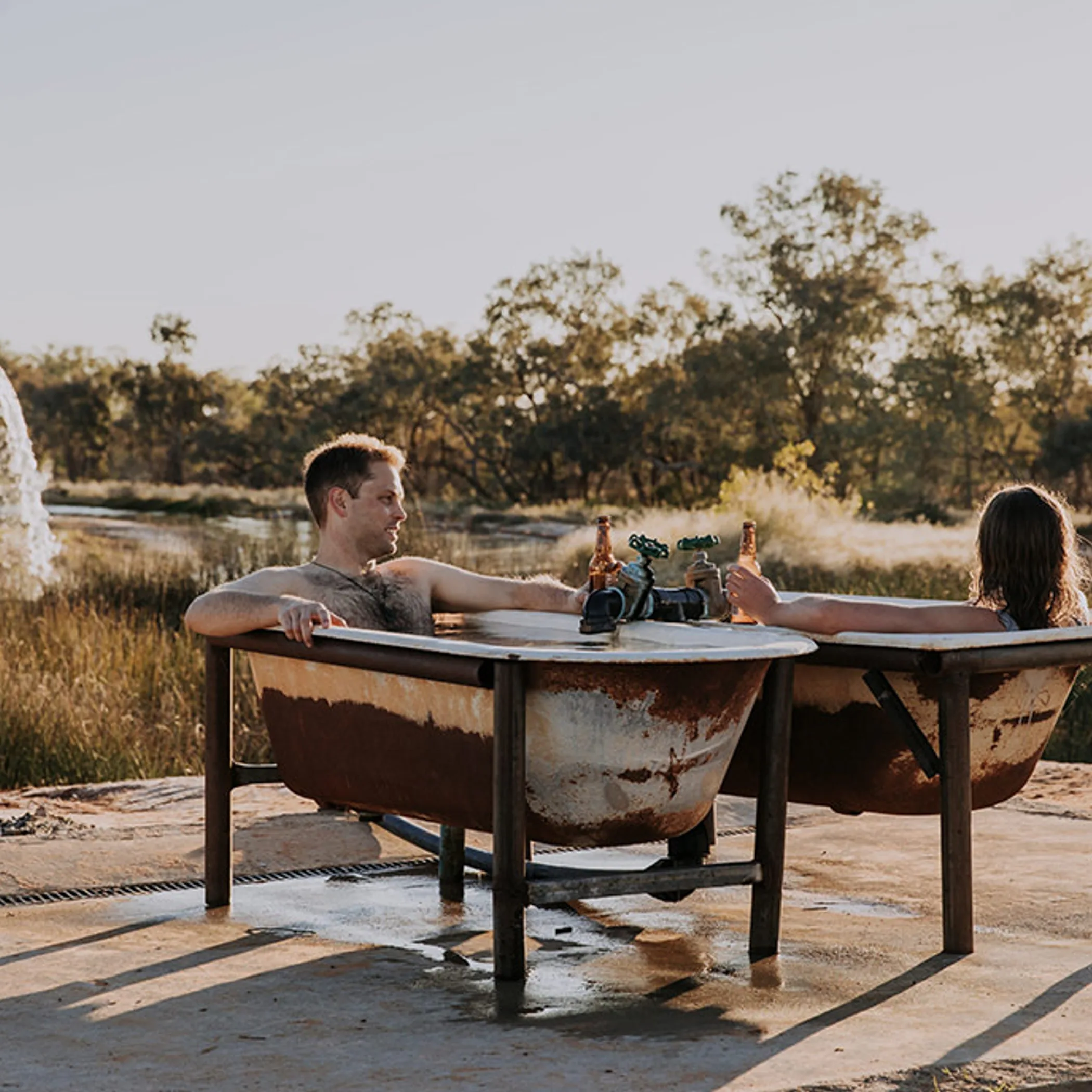 people enjoying an outdoor hot spring