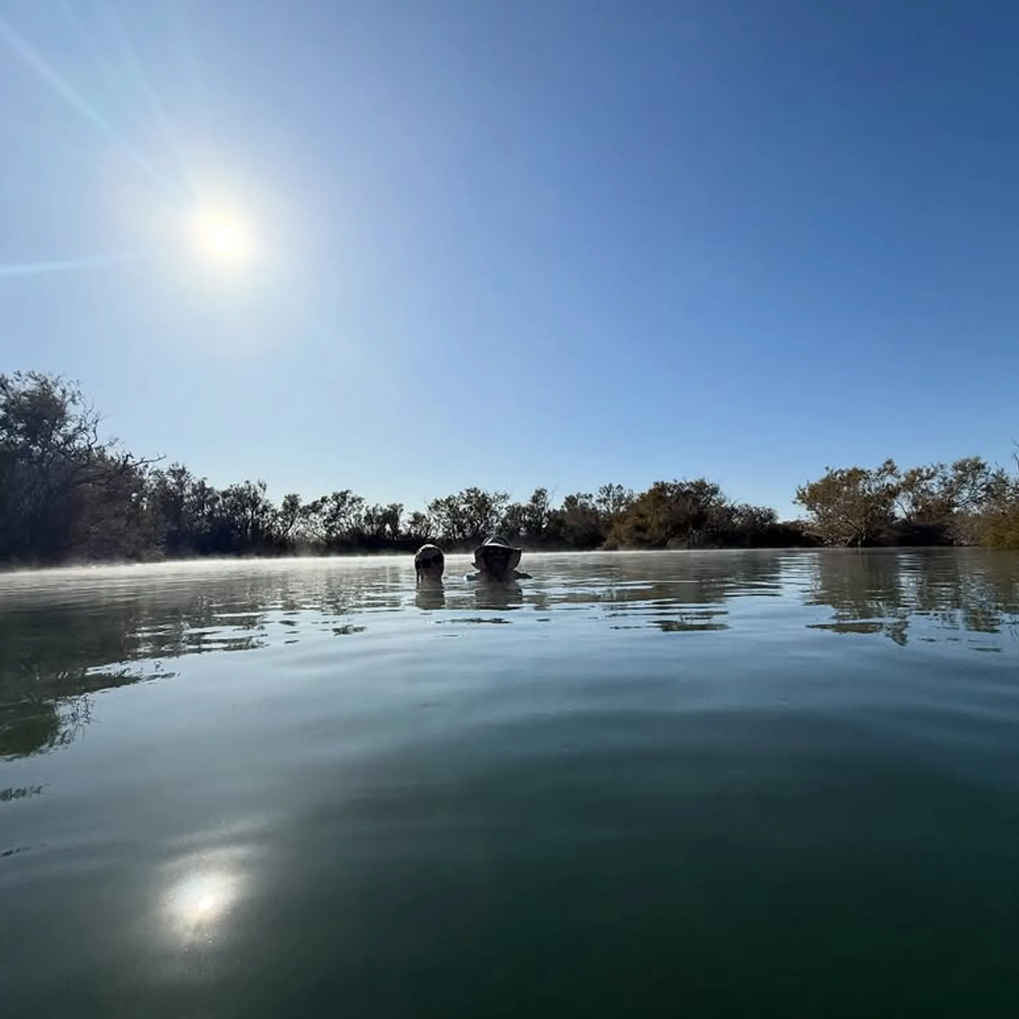 people enjoying australian hot springs
